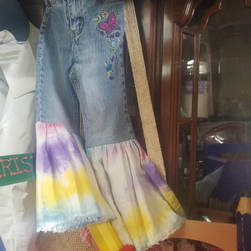 Custom embroidered denim bell-bottom design