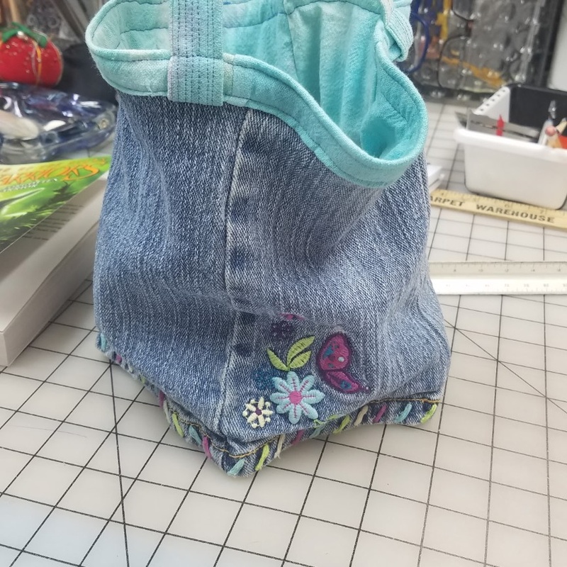 Handmade denim tote bag with turquoise lining